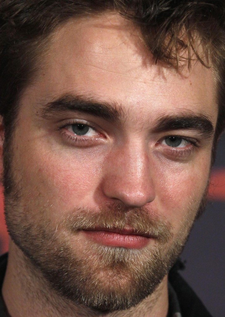 Cast member Pattinson poses to promote "Breaking Dawn" from the Twilight Saga in Brussels